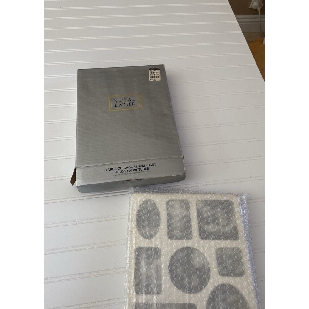 Royal Limited large silverplate collage album frame that holds 100 pictures.